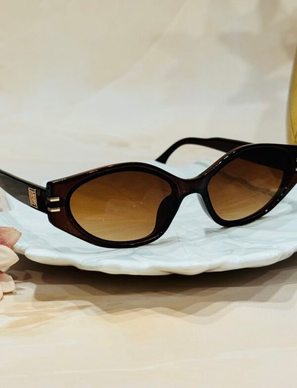 Brown, oval, grey lens, funky sunglasses