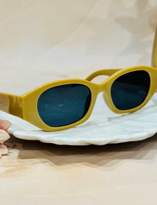 Beige, oval, grey lens, funky sunglasses