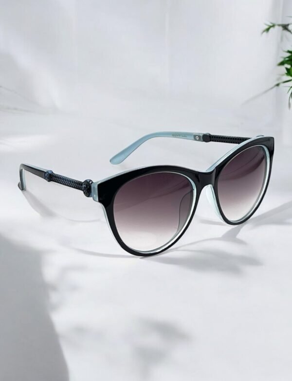 Black frame, green arms, cateye sunglasses